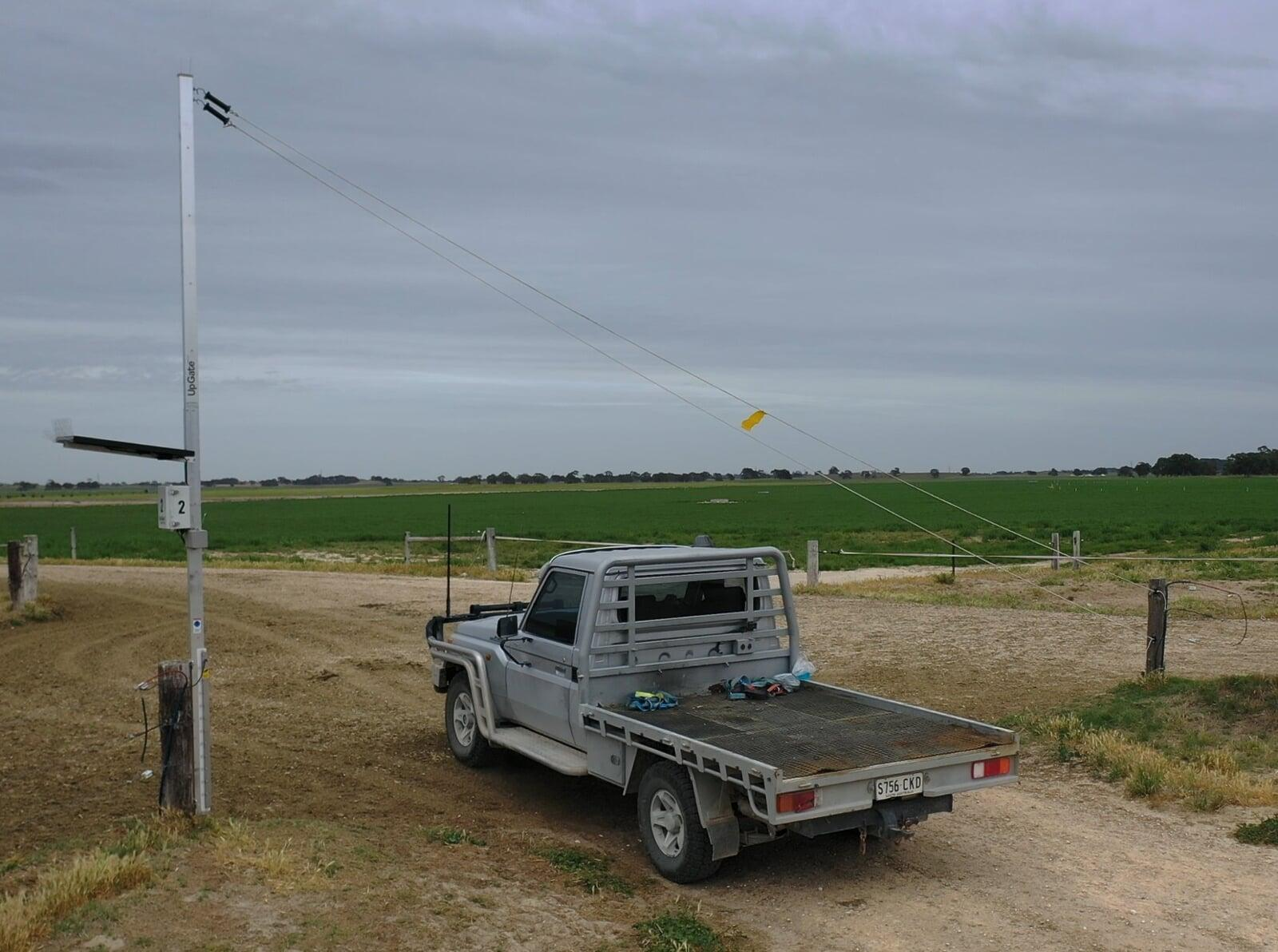 Farm vehicle passing through an open UpGate gateway